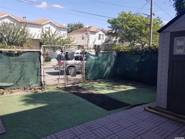 view of yard with a gate and fence