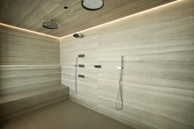 full bath featuring a tile shower