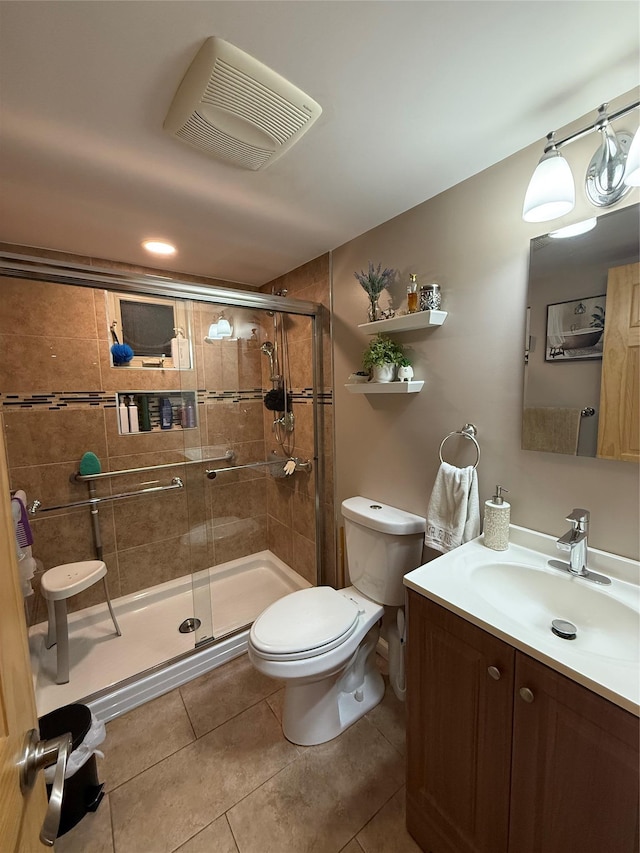 full bath featuring tile patterned flooring, toilet, vanity, visible vents, and a shower stall