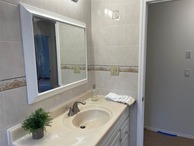 bathroom with tile walls and vanity