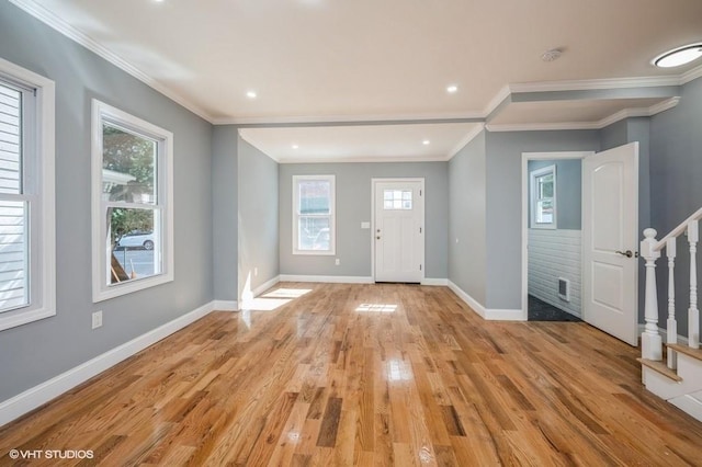 foyer with baseboards, stairway, ornamental molding, light wood-style floors, and recessed lighting