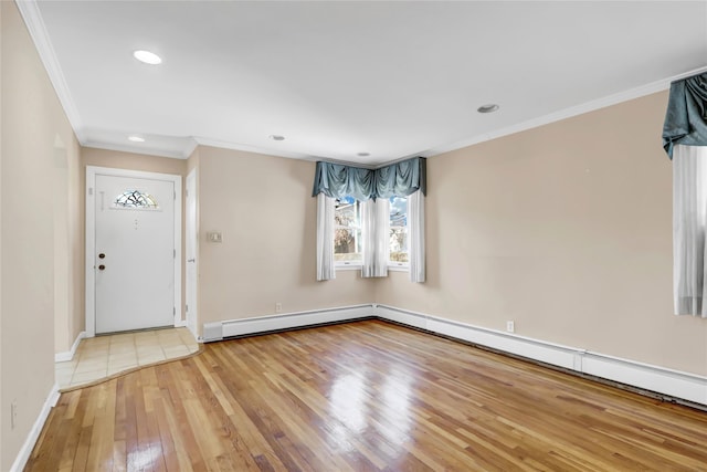 foyer featuring baseboards, hardwood / wood-style floors, ornamental molding, baseboard heating, and recessed lighting