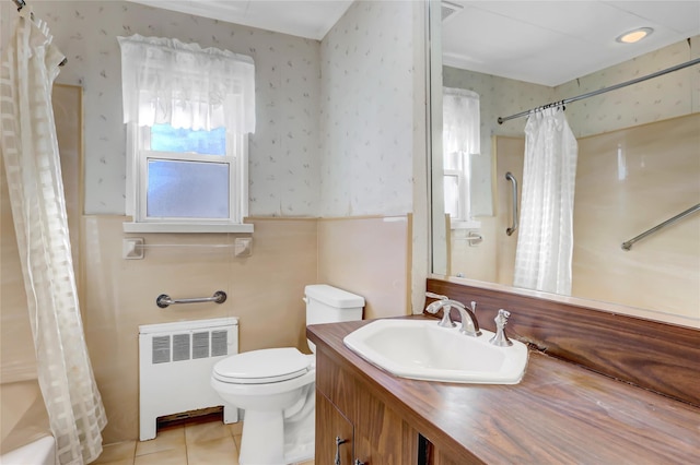 bathroom featuring tile patterned flooring, toilet, wallpapered walls, and radiator heating unit