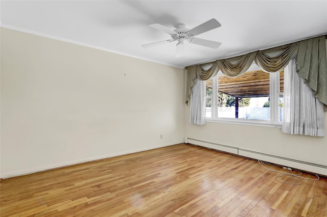 empty room with light wood-type flooring, crown molding, baseboards, baseboard heating, and ceiling fan