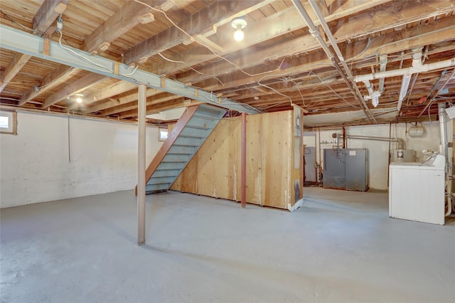 basement featuring stairway and washer / clothes dryer