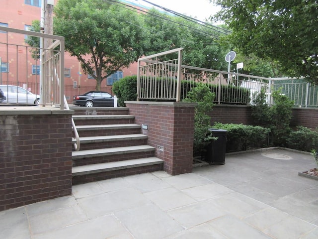 view of patio / terrace featuring fence