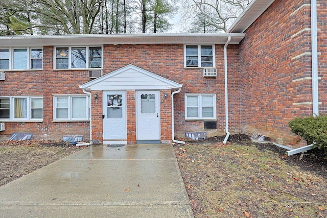 view of property with brick siding