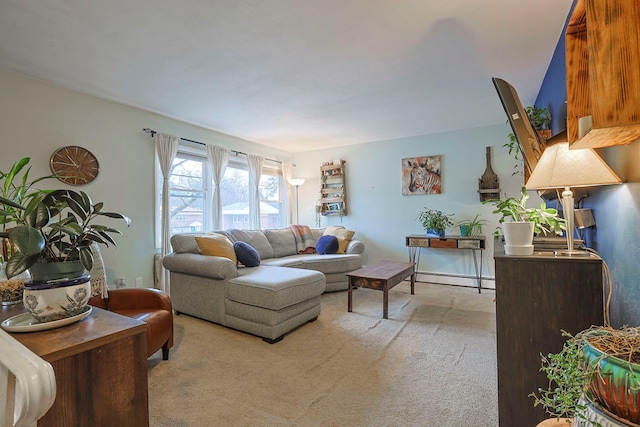 living room with baseboard heating and light colored carpet