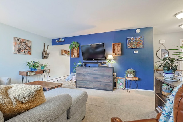 carpeted living area featuring a baseboard heating unit and baseboards