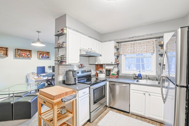 kitchen featuring a sink, stainless steel appliances, open shelves, and white cabinets