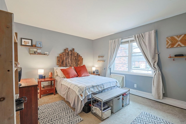 carpeted bedroom featuring baseboards and baseboard heating