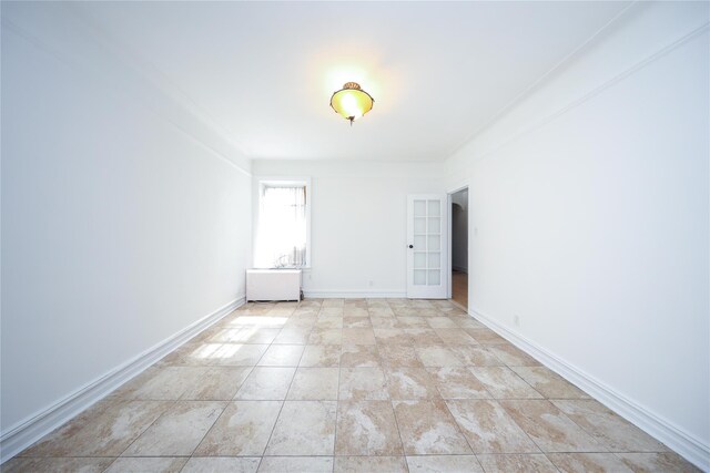 empty room featuring baseboards