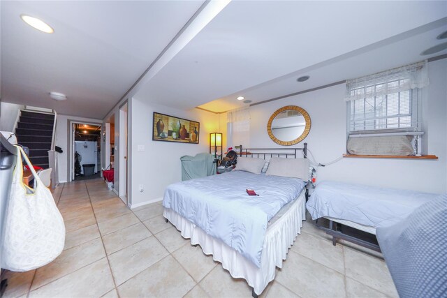 bedroom with recessed lighting, baseboards, and light tile patterned flooring