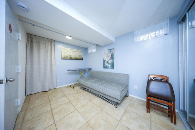 interior space with tile patterned floors and baseboards