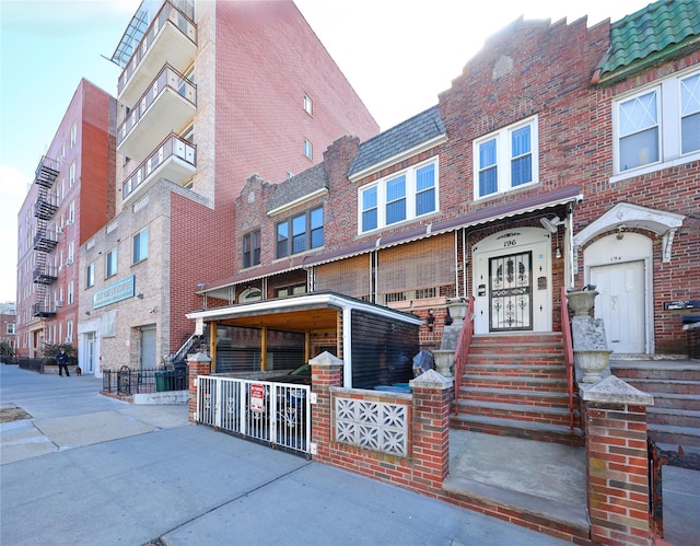 view of property featuring brick siding