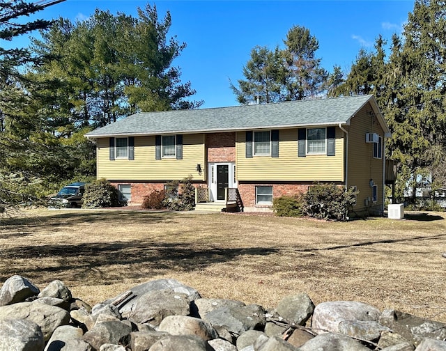 raised ranch with brick siding and central AC