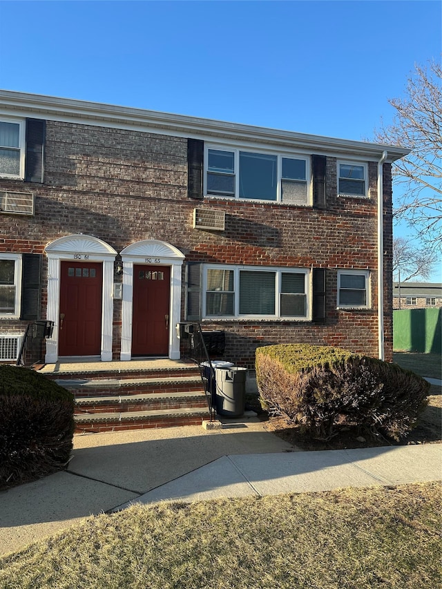 view of front of house featuring brick siding