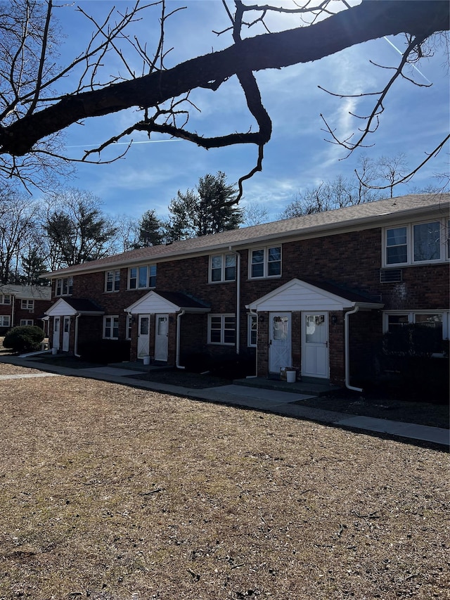 view of front of home with brick siding