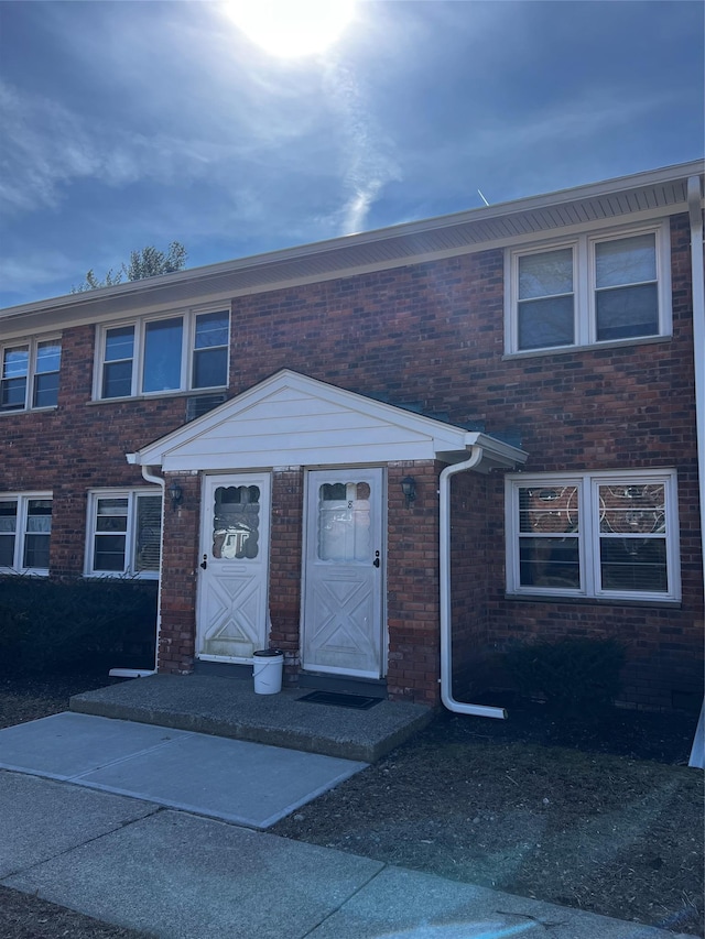 multi unit property featuring brick siding