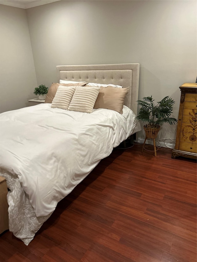 bedroom with wood finished floors