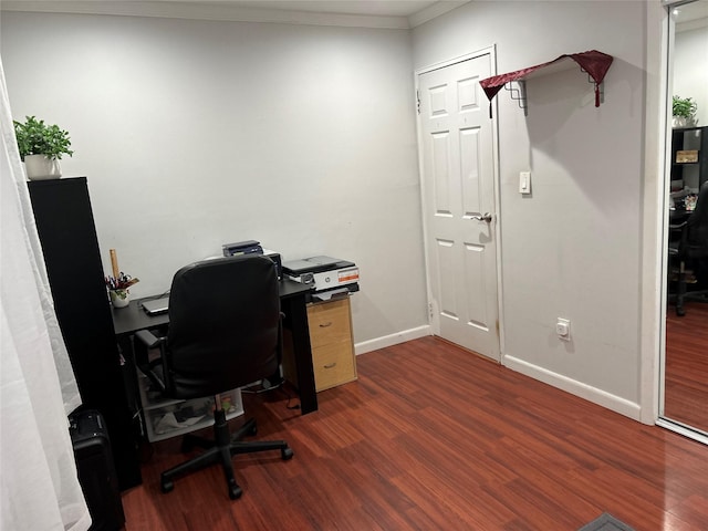 office featuring baseboards, dark wood-style flooring, and ornamental molding