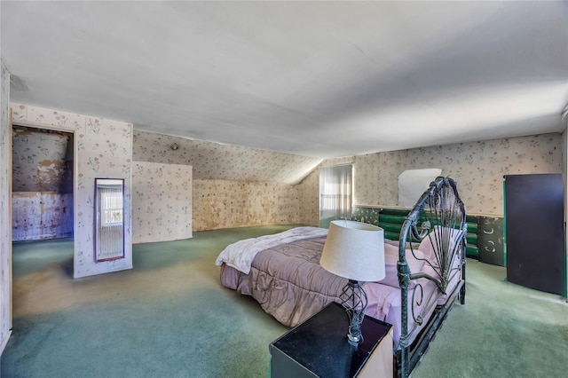 bedroom with wallpapered walls and carpet