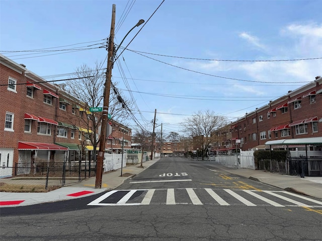 3645 Fenton Ave, Bronx, NY 10469 - view of road with a residential view, curbs, sidewalks, and street lighting