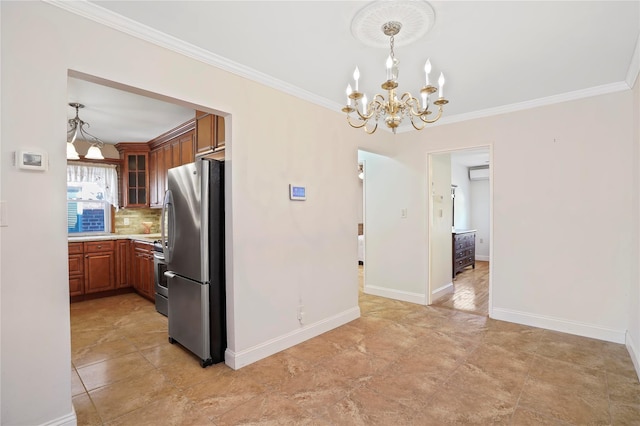 kitchen featuring tasteful backsplash, brown cabinetry, stainless steel appliances, light countertops, and a chandelier