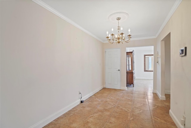 interior space with baseboards, a chandelier, and crown molding