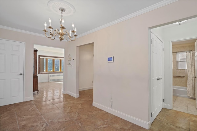 unfurnished dining area with crown molding, baseboards, and radiator