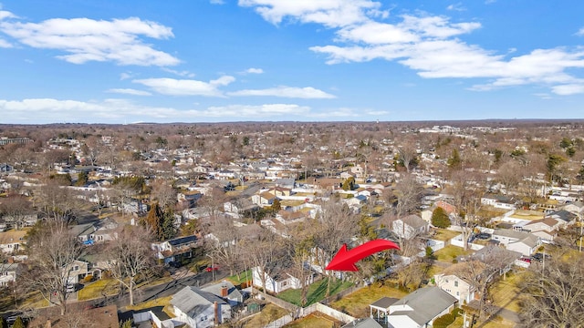 birds eye view of property with a residential view