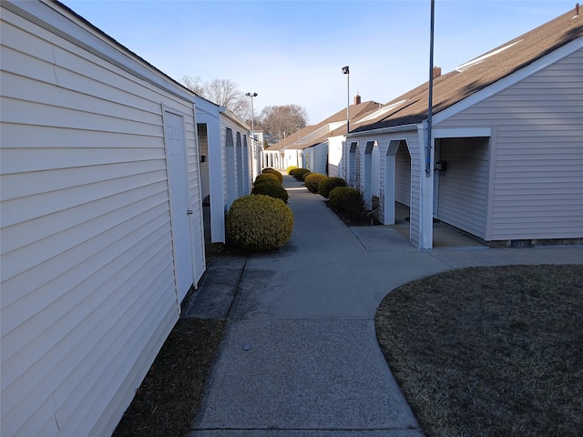 exterior space with a residential view, fence, and a patio