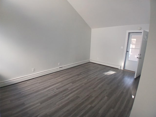 interior space with a baseboard radiator, vaulted ceiling, and dark wood-type flooring