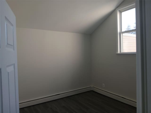 additional living space with lofted ceiling and dark wood finished floors