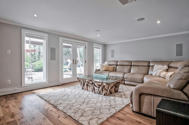 living area featuring ornamental molding, french doors, and light wood-type flooring