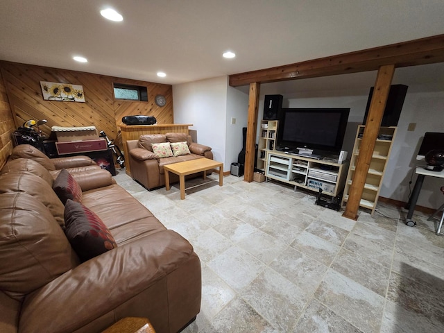 living room featuring recessed lighting, wooden walls, and baseboards