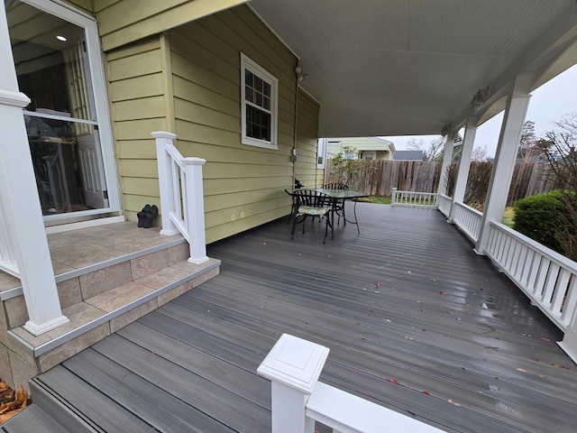 wooden terrace with outdoor dining area