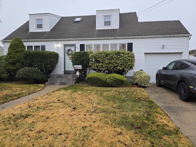 cape cod-style house with a garage, a front yard, concrete driveway, and a shingled roof