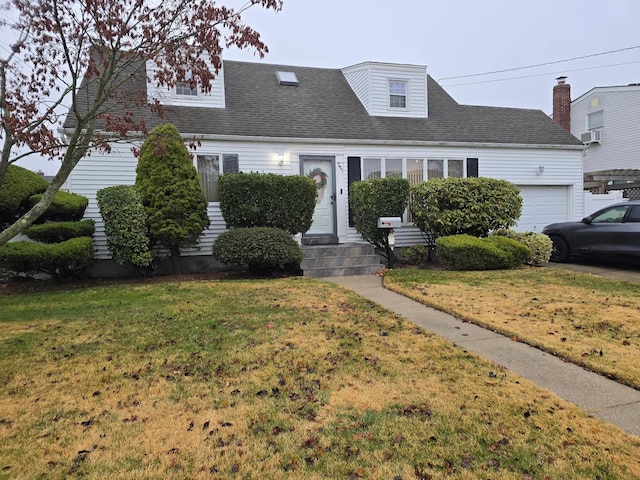 cape cod home with a garage, a front lawn, roof with shingles, and cooling unit