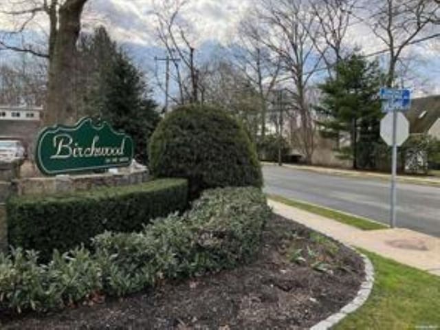 view of road with traffic signs and sidewalks