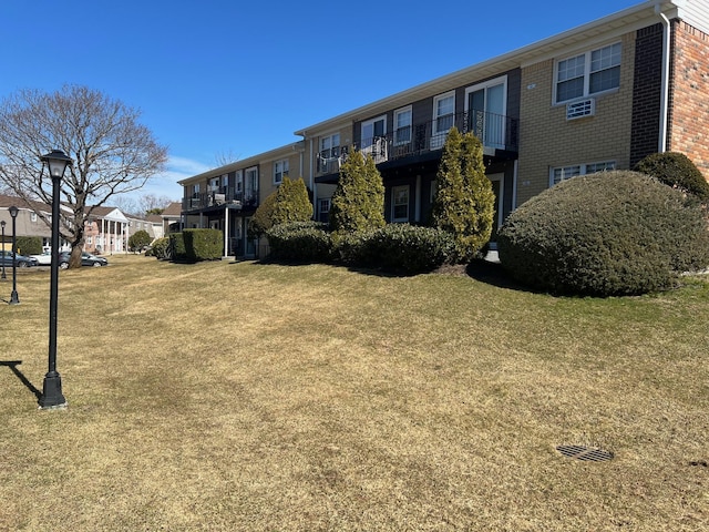 surrounding community with a lawn and a residential view