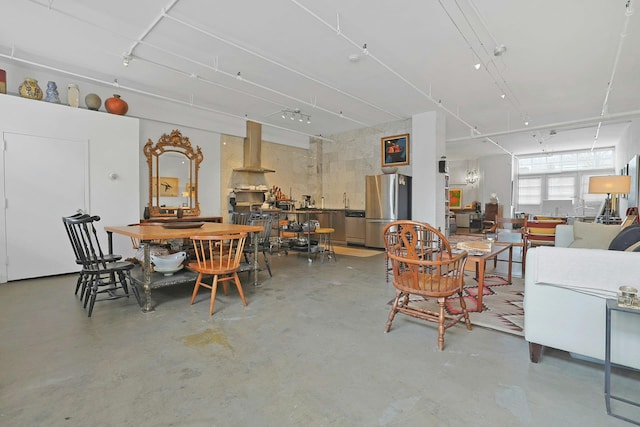 dining room with finished concrete floors