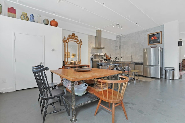 dining space with finished concrete flooring