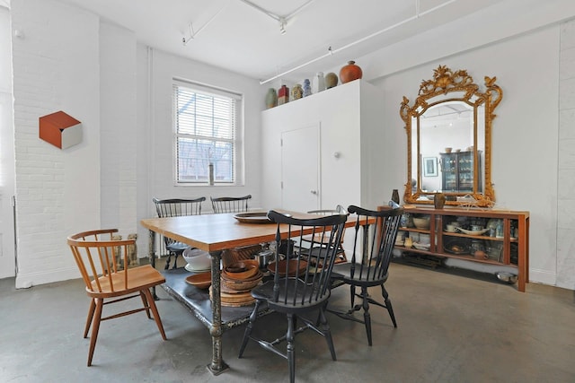 dining room featuring concrete floors