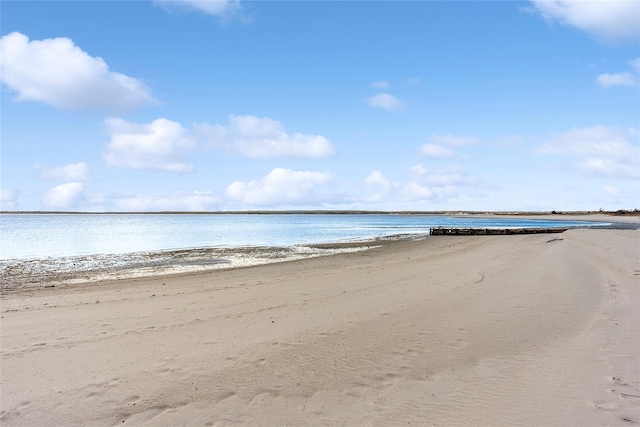 property view of water featuring a beach view