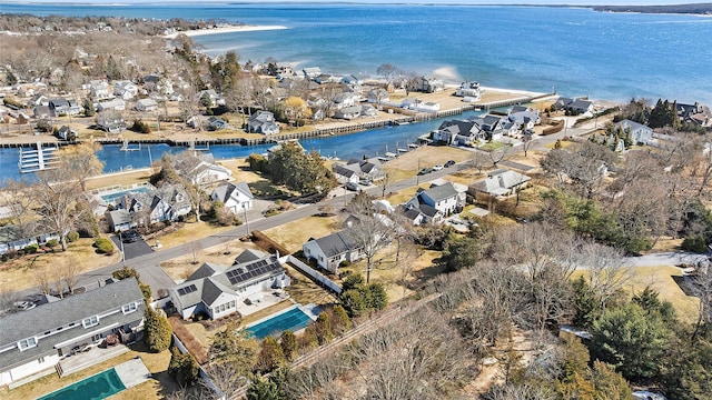 drone / aerial view featuring a residential view and a water view