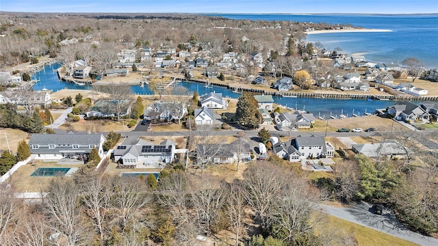 drone / aerial view featuring a residential view and a water view