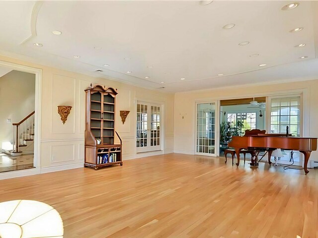 25 Pine Glen Dr, Blauvelt, NY 10913 - living area featuring a decorative wall, light wood-style flooring, recessed lighting, stairway, and french doors