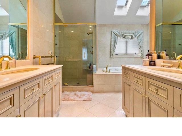 25 Pine Glen Dr, Blauvelt, NY 10913 - bathroom featuring a skylight, a shower stall, a sink, a garden tub, and tile patterned flooring