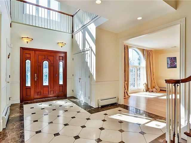25 Pine Glen Dr, Blauvelt, NY 10913 - entrance foyer featuring baseboards, a high ceiling, and a baseboard radiator